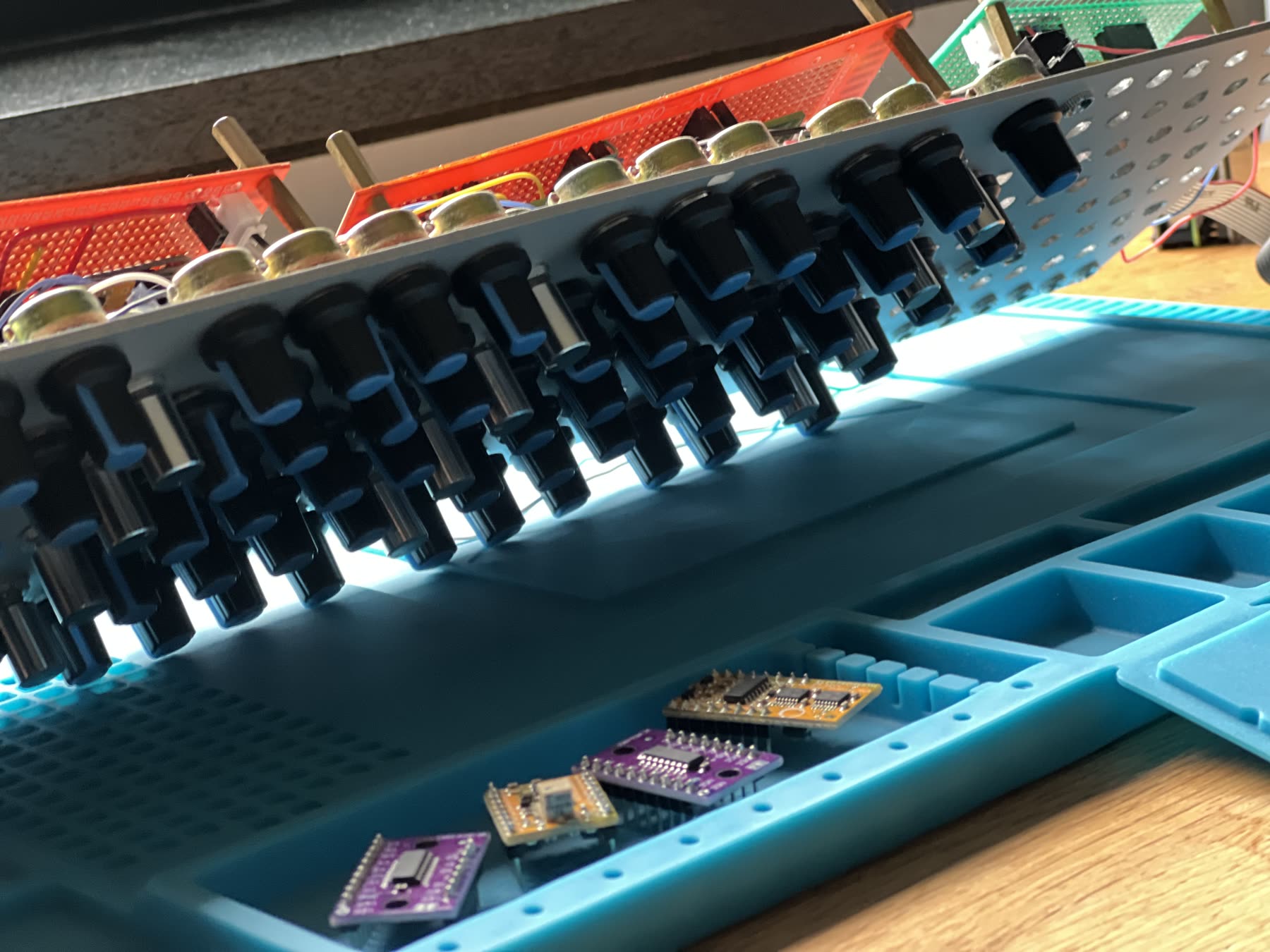Close-up of the groovebox panel with many knobs and patch jacks.